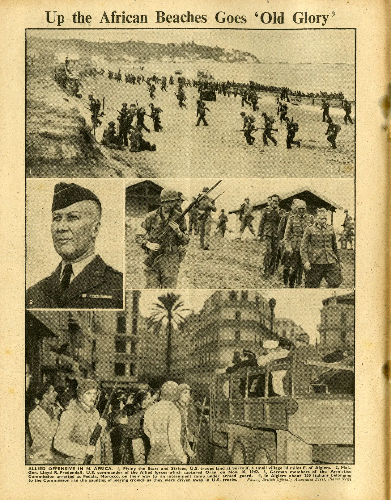 A page of The War Illustrated showing several photos of American soldiers in North Africa. The top picture shows a force of a couple hundred men landing on a beach and moving inland. In the center is a photo of an American general and another of American soldiers escorting captured prisoners of war. The last photo shows American soldiers riding on foot and in a large truck riding into a busy city center.